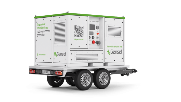 White mobile hydrogen generator on a trailer with "HyGenset" branding and control panel visible. White mobile hydrogen generator on a trailer with "HyGenset" branding and control panel visible.