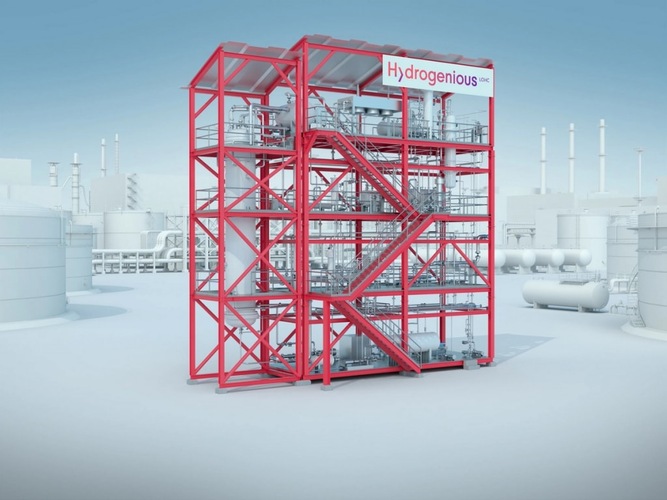 A red industrial hydrogen processing structure stands in a light, futuristic plant setting. A red industrial hydrogen processing structure stands in a light, futuristic plant setting.