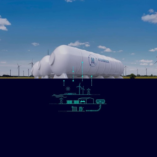 Large white hydrogen storage tanks above ground with wind turbines in background and a schematic overlay below. Large white hydrogen storage tanks above ground with wind turbines in background and a schematic overlay below.