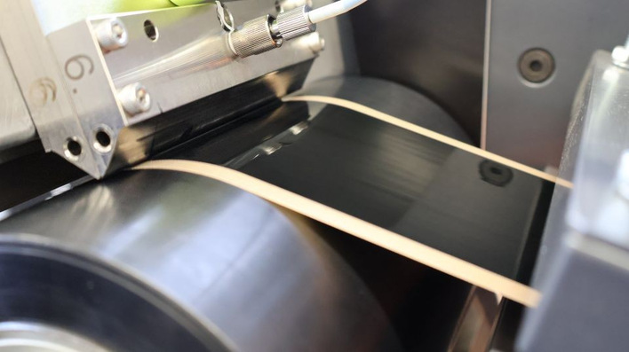 Catalyst ink is continuously applied to a transfer film using a slot-die coater.