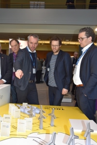"This is how we imagine the future," explained GP Joule CEO O. Petersen to Energy Turnaround Minister J. P. Albrecht (centre); right: Exhibition boss A. Petersen